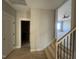 A light-filled hallway showcases access to bedrooms and a bathroom at 165 Cotton Fields Ln # 25, Fuquay Varina, NC 27526
