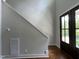 Hallway with dark wood door and trim at 165 Cotton Fields Ln # 25, Fuquay Varina, NC 27526