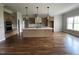 Spacious kitchen with a large island, modern light fixtures and stainless steel appliances offers ample counter space at 165 Cotton Fields Ln # 25, Fuquay Varina, NC 27526