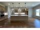 Modern kitchen with stainless steel appliances, a large kitchen island, and custom cabinetry at 165 Cotton Fields Ln # 25, Fuquay Varina, NC 27526