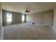 Unfinished living room featuring abundant natural light, ceiling fan, and neutral walls at 165 Cotton Fields Ln # 25, Fuquay Varina, NC 27526