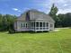 Beautiful home boasts a large, green lawn and a charming screened-in back porch at 165 Cotton Fields Ln # 25, Fuquay Varina, NC 27526