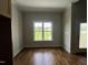 Bright room with hardwood floors and a view of the yard at 165 Cotton Fields Ln # 25, Fuquay Varina, NC 27526