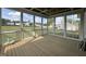 A bright and airy screened-in porch with a wooden ceiling, offering a view of the backyard at 165 Cotton Fields Ln # 25, Fuquay Varina, NC 27526