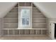 Built-in shelving surrounds a large window in this modern, unfinished bedroom at 165 Cotton Fields Ln # 25, Fuquay Varina, NC 27526