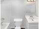 Bathroom features a white vanity, toilet, a shower with tub and tile floors at 204 Colonial Dr, Clayton, NC 27527