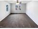 Empty bedroom features neutral paint, carpet, two windows, and ceiling fan at 204 Colonial Dr, Clayton, NC 27527