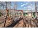 Relaxing backyard setting with a hammock swing, seating, and charming green accents on the home at 221 Saddle Ridge Rd, Chapel Hill, NC 27514