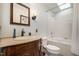 Bathroom featuring a skylight, tub/shower combo, and vanity sink with traditional-style hardware at 221 Saddle Ridge Rd, Chapel Hill, NC 27514
