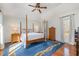 This bedroom has a four poster bed and windows that let in natural light at 221 Saddle Ridge Rd, Chapel Hill, NC 27514
