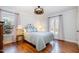 Bright bedroom features hardwood floors, a queen sized bed and lots of natural light at 221 Saddle Ridge Rd, Chapel Hill, NC 27514