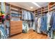 Walk-in closet with custom shelving and storage solutions for clothes and shoes at 221 Saddle Ridge Rd, Chapel Hill, NC 27514