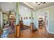 Spacious dining room with decorative columns, hardwood floors, and views into the living room at 221 Saddle Ridge Rd, Chapel Hill, NC 27514