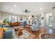 Inviting living room with hardwood floors, built-in bookshelves, and ample seating area at 221 Saddle Ridge Rd, Chapel Hill, NC 27514