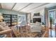 Bright living room with fireplace, beamed ceiling, and large windows at 221 Saddle Ridge Rd, Chapel Hill, NC 27514