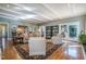 Open living room with hardwood floors and cozy seating arrangement at 221 Saddle Ridge Rd, Chapel Hill, NC 27514
