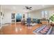 Spacious living room with hardwood floors, built-in cabinets, and large windows providing natural light at 221 Saddle Ridge Rd, Chapel Hill, NC 27514