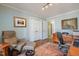 Office area features a recliner, hardwood floors, and warm paint color at 221 Saddle Ridge Rd, Chapel Hill, NC 27514