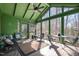 Bright sunroom featuring a vaulted ceiling, brick flooring and lots of natural light at 221 Saddle Ridge Rd, Chapel Hill, NC 27514