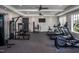 Well-equipped community gym featuring weight machines, treadmills, elliptical trainers and a flat screen TV at 269 Broomside Ave, Raleigh, NC 27603