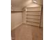 Large walk-in closet with built-in shelving and ample storage space at 27 Innisfree Dr, Durham, NC 27707