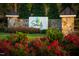 Beautiful community entrance sign with stone pillars and colorful flowerbeds creating a welcoming atmosphere at 270 Inspiration Way Way, Fuquay Varina, NC 27526