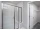 Modern bathroom showcasing a glass-enclosed shower and easy access to the walk-in closet at 281 Broomside Ave, Raleigh, NC 27603