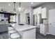 Spacious kitchen with stainless steel appliances, white cabinetry, granite countertops, and island seating at 281 Broomside Ave, Raleigh, NC 27603