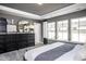 Elegant main bedroom featuring a large window, modern decor, and a comfortable layout at 281 Broomside Ave, Raleigh, NC 27603