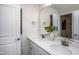 Elegant bathroom with double vanity, quartz countertop and modern fixtures with ample lighting at 285 Broomside Ave, Raleigh, NC 27603