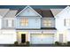 Charming two-story home with a brick-accented garage and traditional design elements at 285 Broomside Ave, Raleigh, NC 27603