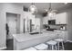 Contemporary kitchen featuring white cabinets, granite countertops, and stainless steel appliances at 285 Broomside Ave, Raleigh, NC 27603