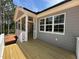 Back deck with a ceiling fan, offering outdoor space and a relaxing view of the treeline at 309 Deer Tail Ln # 42, Fuquay Varina, NC 27526