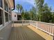 Wooden back deck offering outdoor living space, perfect for entertaining or relaxing in privacy at 309 Deer Tail Ln # 42, Fuquay Varina, NC 27526