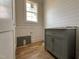 Bathroom featuring a gray vanity, marble countertops, wainscoting, and wooden floors at 309 Deer Tail Ln # 42, Fuquay Varina, NC 27526