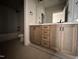 Bathroom with vanity featuring double sink and subway tiled shower at 309 Deer Tail Ln # 42, Fuquay Varina, NC 27526
