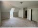Unfinished bedroom with dormer window and ample closet space, offering customization potential at 309 Deer Tail Ln # 42, Fuquay Varina, NC 27526