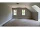 Finished bonus room above the garage with two windows and painted trim at 309 Deer Tail Ln # 42, Fuquay Varina, NC 27526