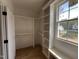 A walk-in closet offers custom built-in shelving, a window, and ample storage space at 309 Deer Tail Ln # 42, Fuquay Varina, NC 27526