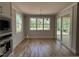 Open dining area with hardwood floors, natural light, and a sliding glass door at 309 Deer Tail Ln # 42, Fuquay Varina, NC 27526