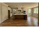 Open kitchen featuring a center island with bar seating, white cabinets, and modern appliances at 309 Deer Tail Ln # 42, Fuquay Varina, NC 27526