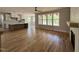 Spacious living room featuring hardwood floors, natural light and open to the kitchen at 309 Deer Tail Ln # 42, Fuquay Varina, NC 27526
