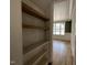 Pantry featuring white subway tile walls, hardwood floors, and wooden shelving at 309 Deer Tail Ln # 42, Fuquay Varina, NC 27526