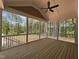 Screened porch with wooded views, ceiling fan, and ample space for outdoor relaxation at 309 Deer Tail Ln # 42, Fuquay Varina, NC 27526