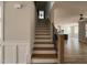 An interior view of staircase featuring hardwood steps and wrought iron railing at 309 Deer Tail Ln # 42, Fuquay Varina, NC 27526