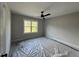 Bright bedroom with large window and ceiling fan at 318 Deer Tail Ln # 35, Fuquay Varina, NC 27526