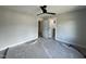 Bedroom featuring ceiling fan and two open doorway views at 318 Deer Tail Ln # 35, Fuquay Varina, NC 27526