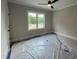 Bright bedroom with a large window offering a view of the outdoors at 318 Deer Tail Ln # 35, Fuquay Varina, NC 27526