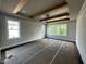 Bedroom features a trey ceiling with wooden beams, three windows, and dark wood flooring at 318 Deer Tail Ln # 35, Fuquay Varina, NC 27526