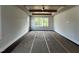 Spacious bedroom features a trey ceiling with wooden beams and several windows for ample natural light at 318 Deer Tail Ln # 35, Fuquay Varina, NC 27526